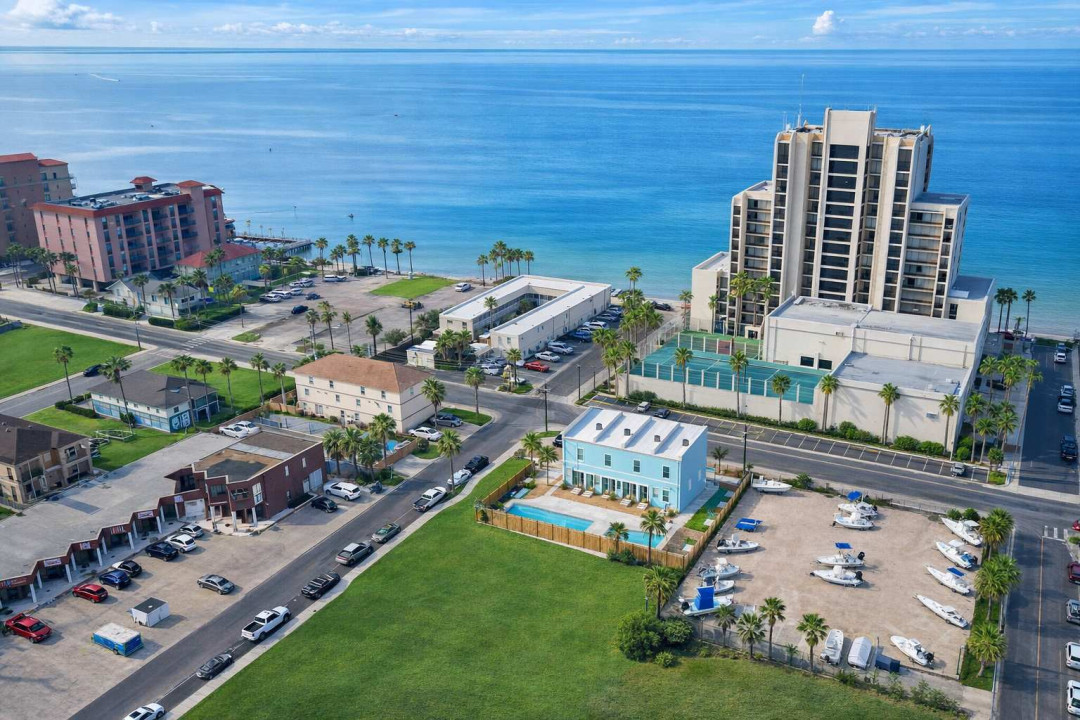 Bright coastal retreat near the Gulf with pool, boat parking, and walkable beach access. Ideal for families or groups seeking sun, serenity, and convenience in a vibrant waterfront neighborhood.