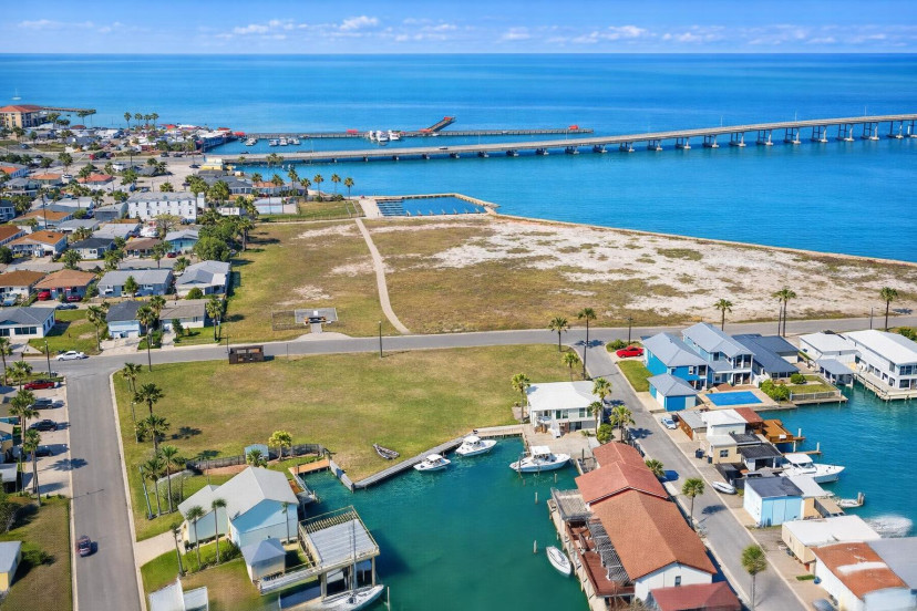 Waterfront retreat with private docks, vibrant coastal views, and easy access to marina, bridge, and beach—perfect for boaters, families, and sunseekers.