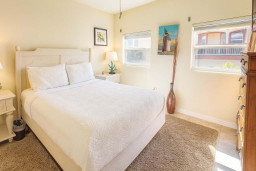 Serene Coastal Bedroom Retreat
Plush comfy bed with paddleboard vibes, lamps, tropical art—pure beach relaxation! Soft lighting, dresser in sunny SPI haven at 113 E Pompano St. Recharge near Gulf sands & SpaceX thrills. Sweet dreams!