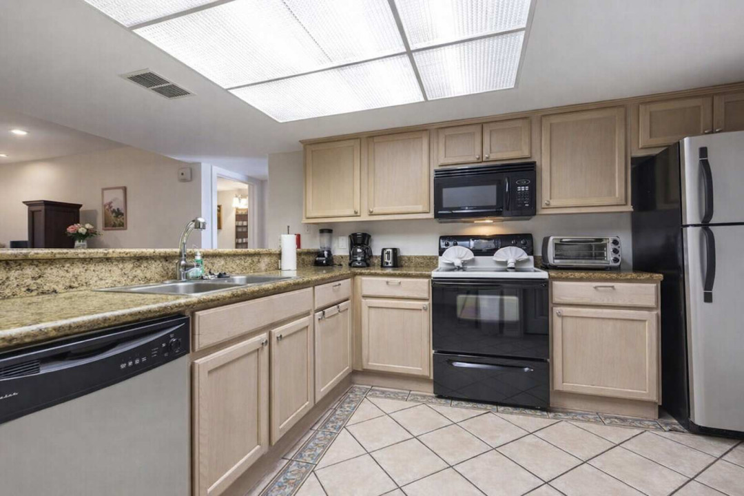 Modern Kitchen with Granite Counters, Stainless Appliances, and Full Coffee Setup – Bright, Clean, and Fully Equipped for Your Stay