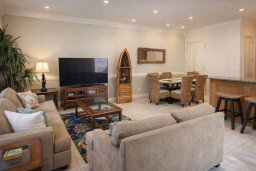 Bright & cozy coastal retreat with vibrant decor, open living-dining layout, tropical accents, and stylish furnishings—perfect for relaxing getaways near the beach.