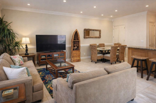Bright & cozy coastal retreat with vibrant decor, open living-dining layout, tropical accents, and stylish furnishings—perfect for relaxing getaways near the beach.