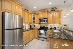 Modern Kitchen with Stainless Steel Appliances, Granite Counters & Cozy Lighting – Perfect for Your Stay!