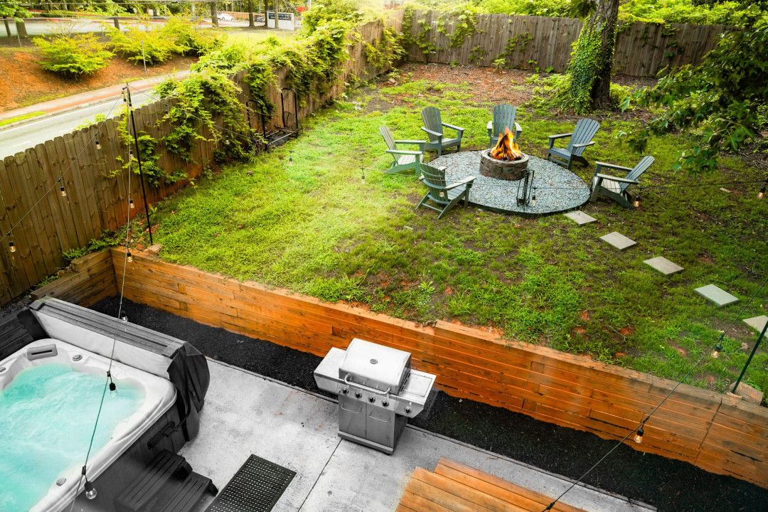 Large Hot Tub, Propane Grill + outdoor dining area,  Fire pit + adirondack chairs