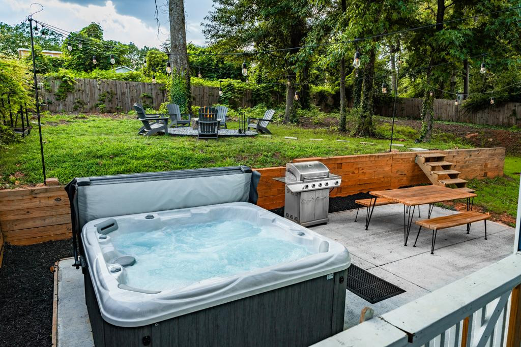 large hot tub for year round use plus firepit and propane grill
