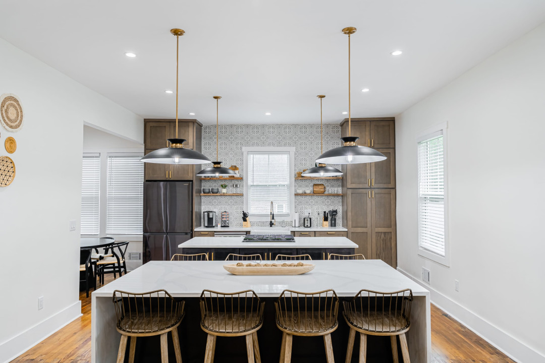 Fully stocked brand new luxury designer kitchen with two islands, and black stainless steel appliances. it'll be a joy to cook for the family in here!
