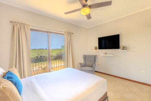 Master Bedroom | When you're ready to unwind after an exhilarating day of exploring Aruba, make your way to this plush queen-size bed.