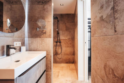 Step into this sleek bathroom, where modern meets functional—perfect for a refreshing start to your day.