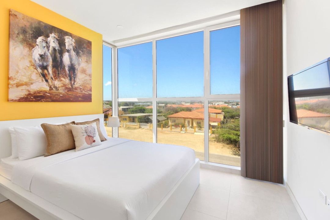 Bedroom 2 | High-quality linens, bedding, and plenty of cushions are provided for a relaxing vacation.