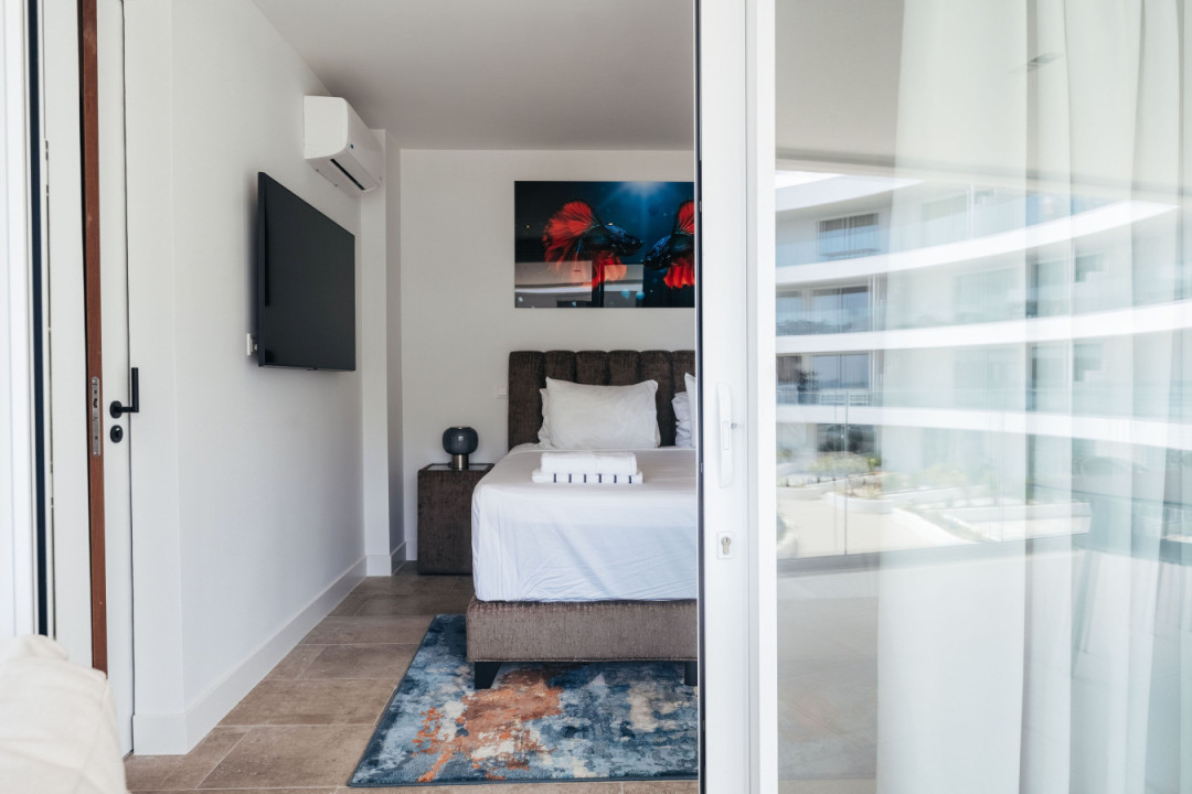 Inviting bedroom retreat with a touch of modern elegance, designed for relaxation and peaceful sleep.