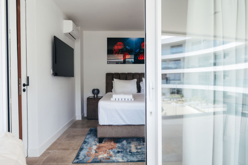 Inviting bedroom retreat with a touch of modern elegance, designed for relaxation and peaceful sleep.