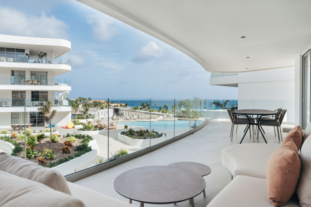 Your front row seat to ocean views and poolside serenity—this balcony is made for slow mornings and sunset lounging.