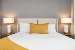 Soft, hotel-style bed with cozy linens—perfect for a restful night’s sleep.