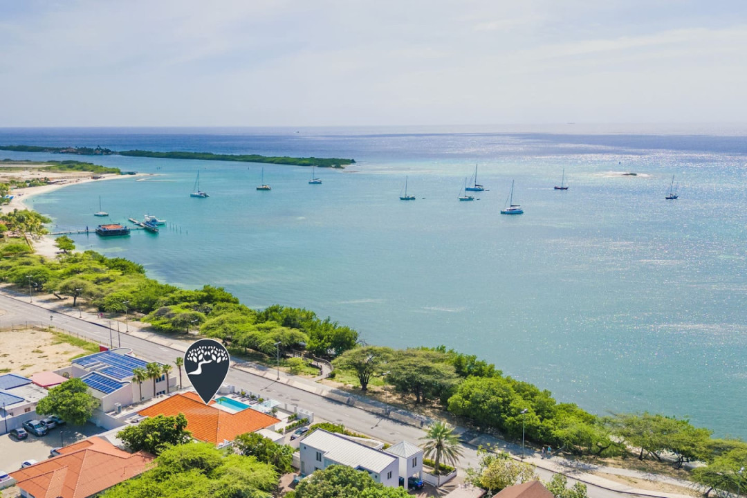 Take in the beautiful exterior of this vibrant coastal retreat—where you can start your day with stunning ocean views, take a refreshing dip in the glistening pool, or enjoy a leisurely walk to nearby white-sand beaches and lively local attractions.