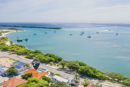 Take in the beautiful exterior of this vibrant coastal retreat—where you can start your day with stunning ocean views, take a refreshing dip in the glistening pool, or enjoy a leisurely walk to nearby white-sand beaches and lively local attractions.
