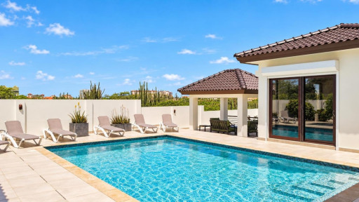 Cool off in the enormous saltwater pool, which has a depth of 6 feet, or just relax in the sun on one of the many resort-style sunloungers around the pool.