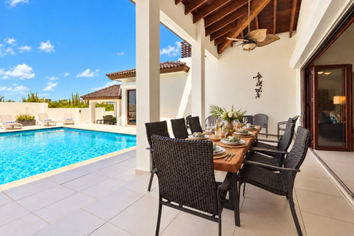 The outdoor area has a custom artisan dining table that can accommodate at least 8 guests. Aruba enjoys the perfect temperatures for dining alfresco.