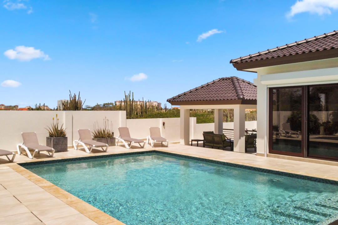 Cool off in the enormous saltwater pool, which has a depth of 6 feet, or just relax in the sun on one of the many resort-style sunloungers around the pool.
