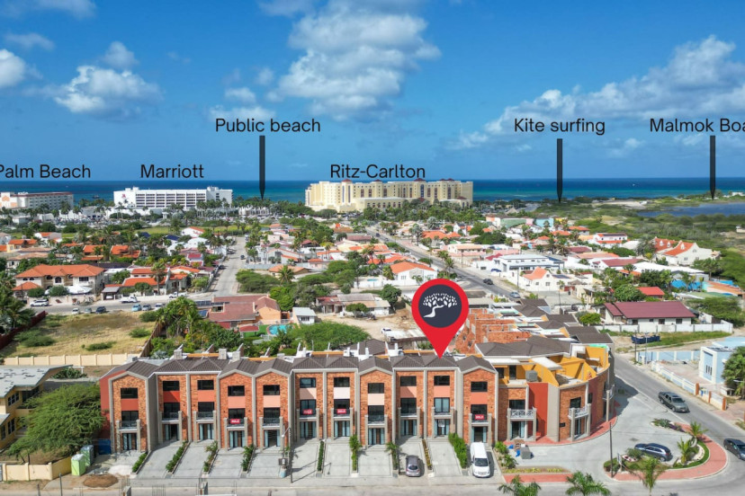 Discover the unparalleled convenience of Porta Al Sole, just minutes away from the renowned Palm Beach, as captured in this stunning drone shot. With its prime location offering easy access to one of Aruba's most coveted destinations.