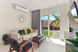 Enjoy a pleasant movie night in this elegant environment by taking a seat on the plush sofa with the warm Caribbean Breeze