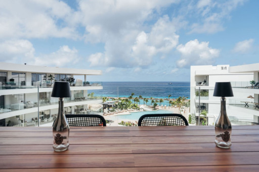 Enjoy outdoor dining with beautiful views of the pool and ocean.