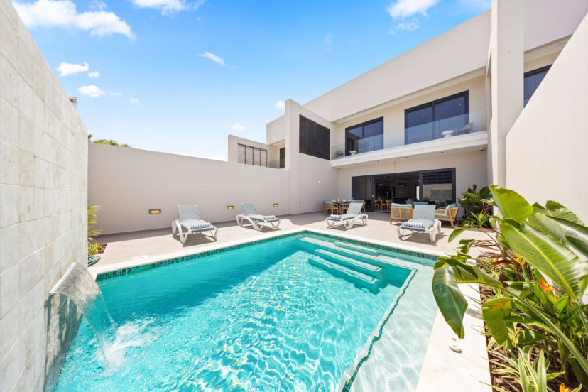 Step into your outdoor space featuring a private pool, perfect for refreshing dips under the Aruban sun.