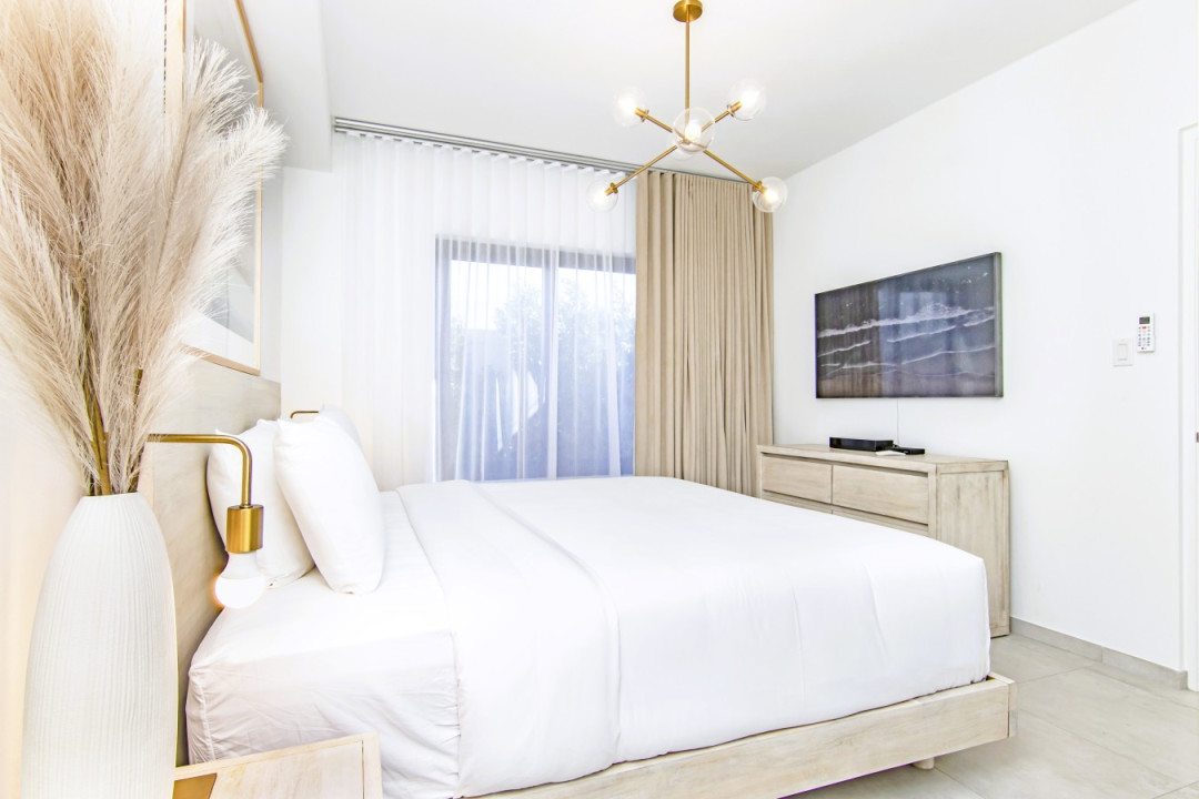 Master Bedroom | Wake up every morning with the sunny blue sky of Aruba right outside your window