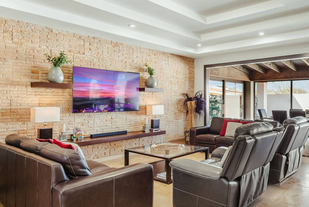 Unwind in style with a cozy, modern living space built for movie nights and pure comfort.