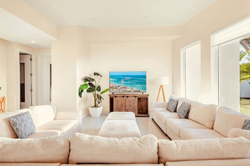 Bright, cozy living space made for relaxing after a day by the beach.