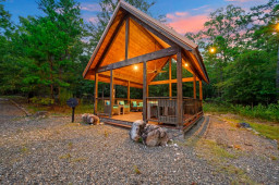 Step outside to your private, covered gazebo—an outdoor oasis designed for entertaining. Unwind in the comfortable lounge seating around the glowing fire table, or gather for meals at the full-size outdoor dining table.