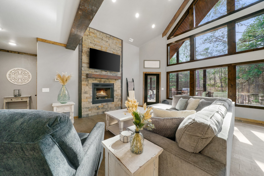 The flat-screen Smart TV and cozy fireplace in the living area make it the perfect spot to gather and unwind.