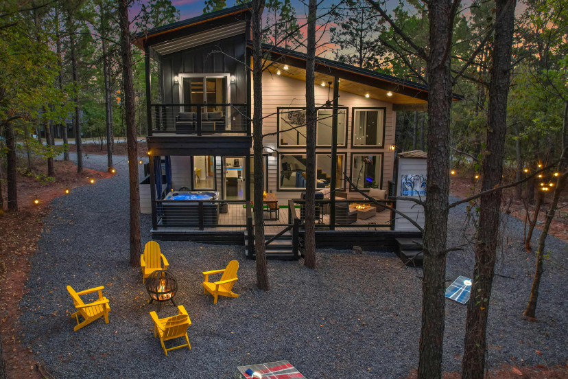 Welcome to Zoey's Haven! This 2BR + 2BA cabin includes an outdoor hot tub, BBQ grill, UNIQUE tree house and backyard playground, fire pit, arcade games & more!