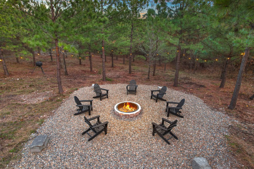 Bonfire pit with Adirondack chairs.
