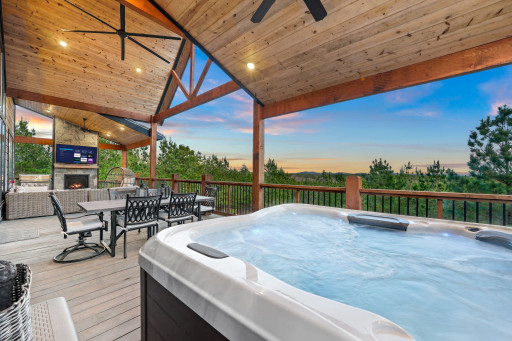 An entertainers paradise with hot tub, fireplace, outdoor dining and Smart TV.