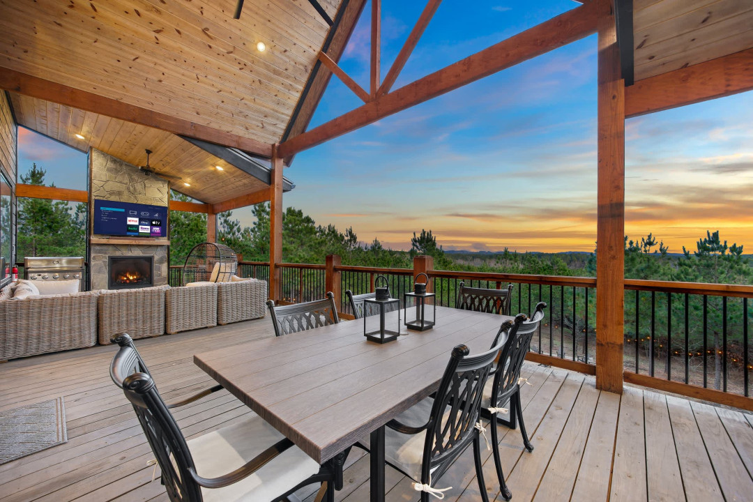 Alfresco dining, sectional couch, Smart TV, Fireplace and views.