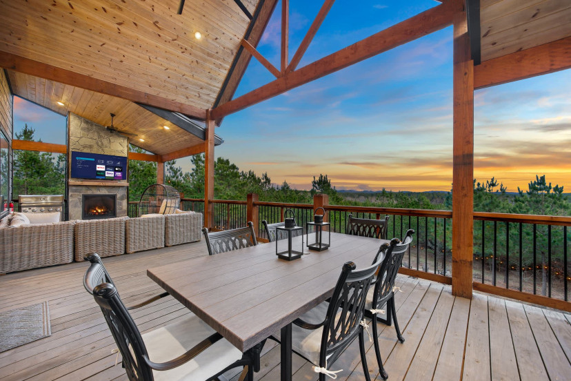 Alfresco dining, sectional couch, Smart TV, Fireplace and views.