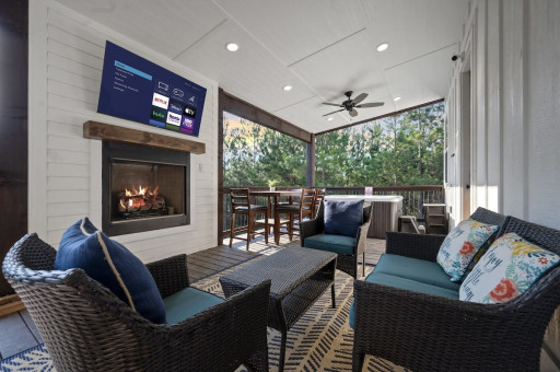 The deck features a Smart TV and gas fireplace to gather around for an outdoor movie night.